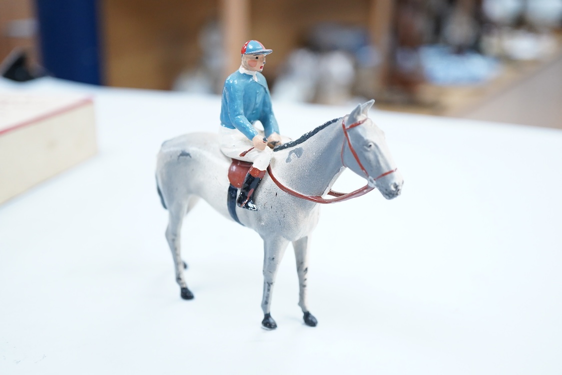 Two boxed Britains Racing Colours of Famous Owners series lead mounted figures; Lord Astor - rider in blue jersey with a pink sash on a grey horse (one leg broken and missing), and. the Duke of Norfolk - rider in blue je
